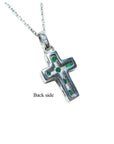 Emerald cross pendant necklace o the back side view.
