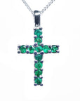 The top view of a natural colombian emerald pendant necklace made in 18k white gold,