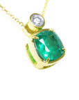 Right side profile of a cushion cut emerald pendant necklace, top and gallery view.