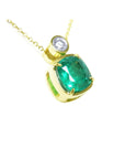 Right side profile of a cushion cut emerald pendant necklace, top and gallery view.