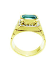 A lateral view of a natural men's emerald ring in yellow gold displaying the top setting and band design.