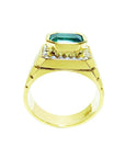 A lateral view of a natural men's emerald ring in yellow gold displaying the top setting and band design.