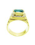 Men's 18K yellow gold ring with a bezel-set emerald-cut green emerald and diamond accents.