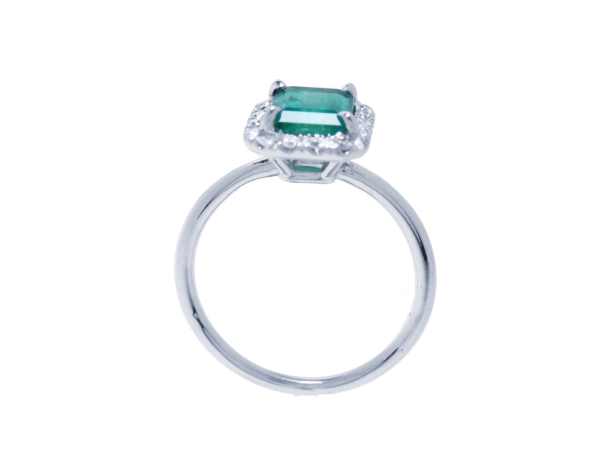 A lateral profile view, top, gallery and band of this emerald ring.