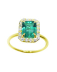 1.69 ct emerald-cut Colombian emerald halo diamond ring in 14K yellow gold.