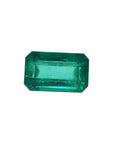 Emerald-cut natural loose colombian emerald, features a medium deep green hue and a rectangular emerald cut.