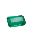 Emerald-cut natural loose colombian emerald, right high position table and crown visibles