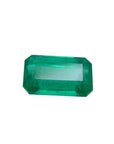 Emerald-cut natural loose colombian emerald, right side table and crown visibles