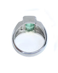 Men's 18K white gold ring with a bezel-set, vibrant emerald-cut Muzo Colombian emerald.