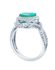 Side profile of this white gold emerald ring on a white background.