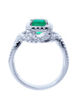 Lateral profile of this emerald and diamond ring displaying the top, gallery and band construction.