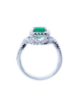 Lateral profile of this emerald and diamond ring displaying the top, gallery and band construction.