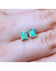 Emerald-cut natural emerald stud earrings, 1.29 ct, set in 14K yellow gold.