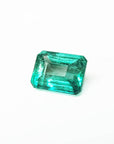 Affordable emerald-cut loose Colombian emerald front left side table and crown view