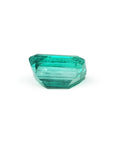 Affordable emerald-cut loose Colombian emerald underneath pavilion view