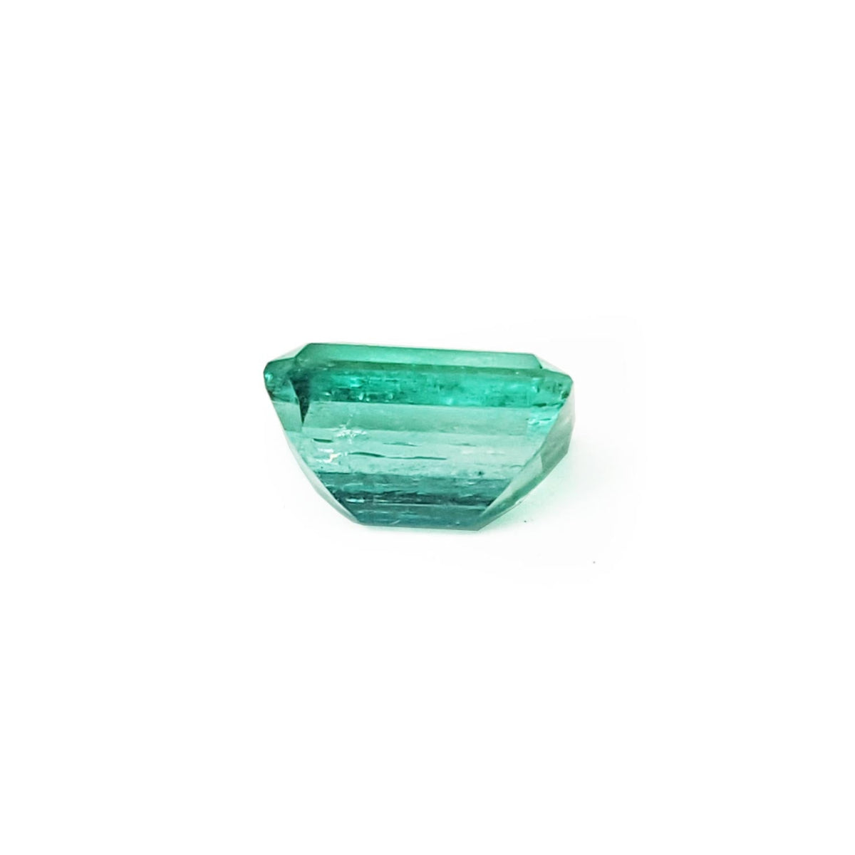 Affordable emerald-cut loose Colombian emerald underside girdle and pavilion view