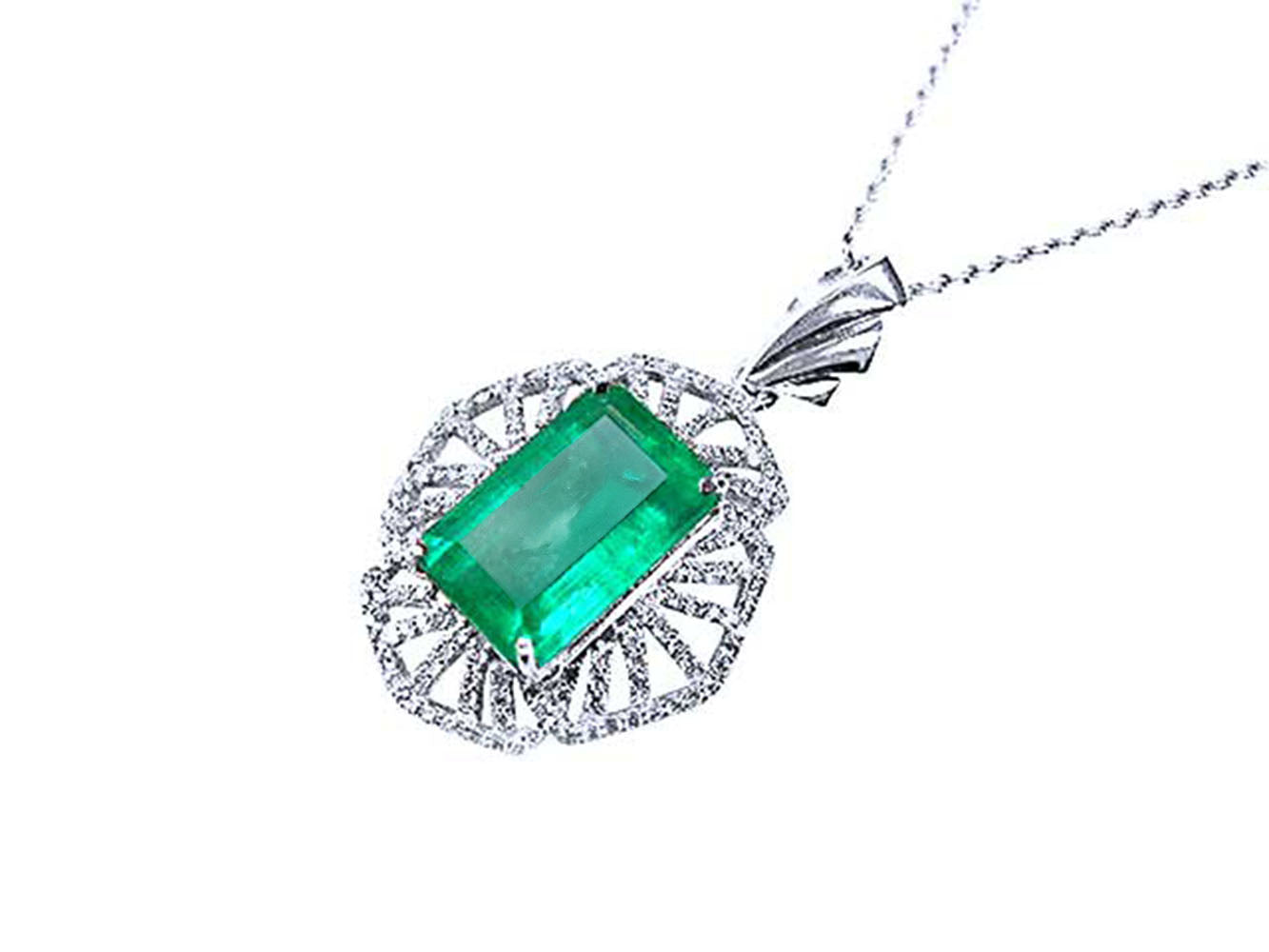 Emerald green gemstone pendant on a white background