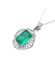 6.19 ct emerald-cut Colombian emerald pendant with natural diamonds in 14K white gold.