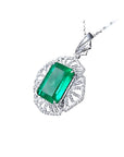 6.19 ct. emerald-cut Colombian emerald pendant with natural diamonds in 14K white gold.