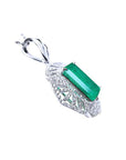 The underside view of a natural emerald-cut emerald pendant in white gold and accent diamonds.