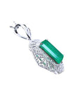 The underside view of a natural emerald-cut emerald pendant in white gold and accent diamonds.