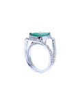 Emerald-cut 3.90 ct bluish-green emerald ring with triple diamond rows in 14K white gold.