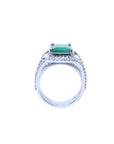 A lateral profile of a white gold emerald ring for women, top and gallery view.
