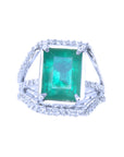 This is an emerald-cut natural emerald ring for women on a topside position, up to down view.