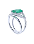 14k white gold ring with emerald on top and side profile visibles.