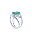 14K white gold ring with rectangular emerald-cut emerald and diamond split shank.