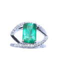 14k white gold ring with a rectangular colombian emerald and split shank with diamonds for ladies.