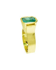 Emerald-cut emerald solitaire ring, bezel set in high polish 14K solid gold.