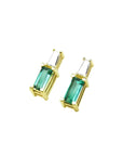 Minimalist 14K gold stud earrings with baguette emeralds and tapered diamond accents.