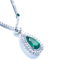 Colombian pear cut emerald necklace with a rich, deep green hue, set in 18K white gold and double halo diamonds.