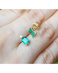 14K yellow gold stud earrings with rectangular Colombian emeralds and accent diamonds.