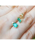 14K yellow gold stud earrings with rectangular Colombian emeralds and accent diamonds.