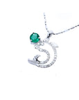 14K white gold dolphin pendant with a round deep green emerald and sparkling accents.
