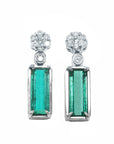 Pair of natural emerald earrings with cluster diamond on top, front position plain top view