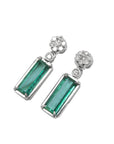 Left side position, top view of a pair of emerald earrings with a cluster diamond on top
