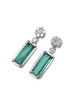 14K white gold dangling earrings with rectangular emeralds and diamond flower clusters.