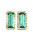 Pair of natural emerald stud earrings with yellow gold frames halo diamond on a white background