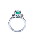 18K white gold engagement ring with a 1.09 ct emerald-cut Colombian emerald and baguette diamonds.