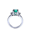 18K white gold engagement ring with a 1.09 ct emerald-cut Colombian emerald and baguette diamonds.
