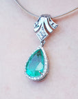 Bridals' Emerald and diamond enhancer necklace pear cut medium green hue 6.01 carats encircle by a halo of natural diamonds