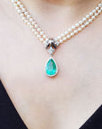Halo diamond enhancer emerald necklace pear cut medium green hue 6.01 carats encircle by a halo of natural diamonds