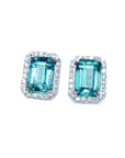Pair of Colombian emerald stud earrings with halo diamond, front position, full top view.