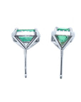 Pair of 14k white gold earrings with natural colombian emeralds, underside view push bacs.