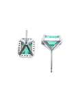 14K white gold emerald-cut stud earrings with vibrant bluish-green emeralds and a diamond halo.
