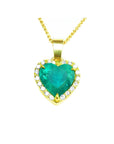 Heart-shaped emerald pendant with gold frame with diamonds and chain on toside view position.