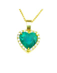 5.04 ct. emerald heart pendant with diamond halo in 18K yellow gold on a gold chain.
